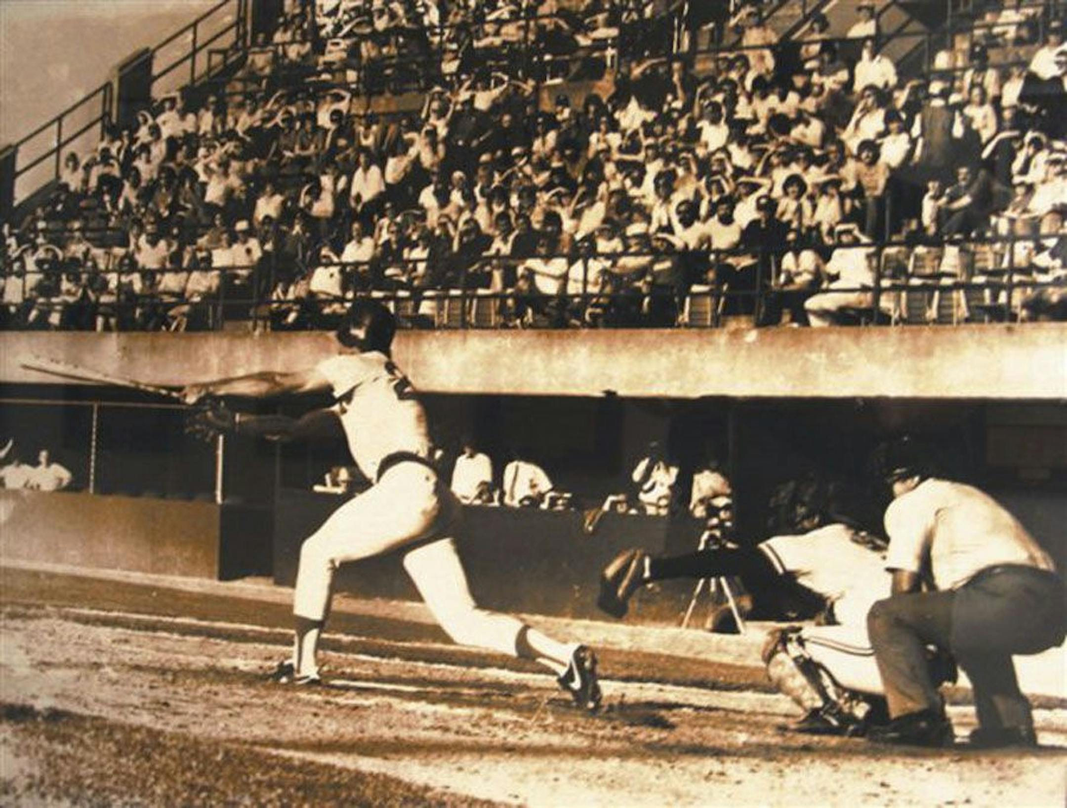 Dave Koza hits a bases-loaded single in the bottom of the 33rd inning to end baseball's longest game in an undated handout photo.