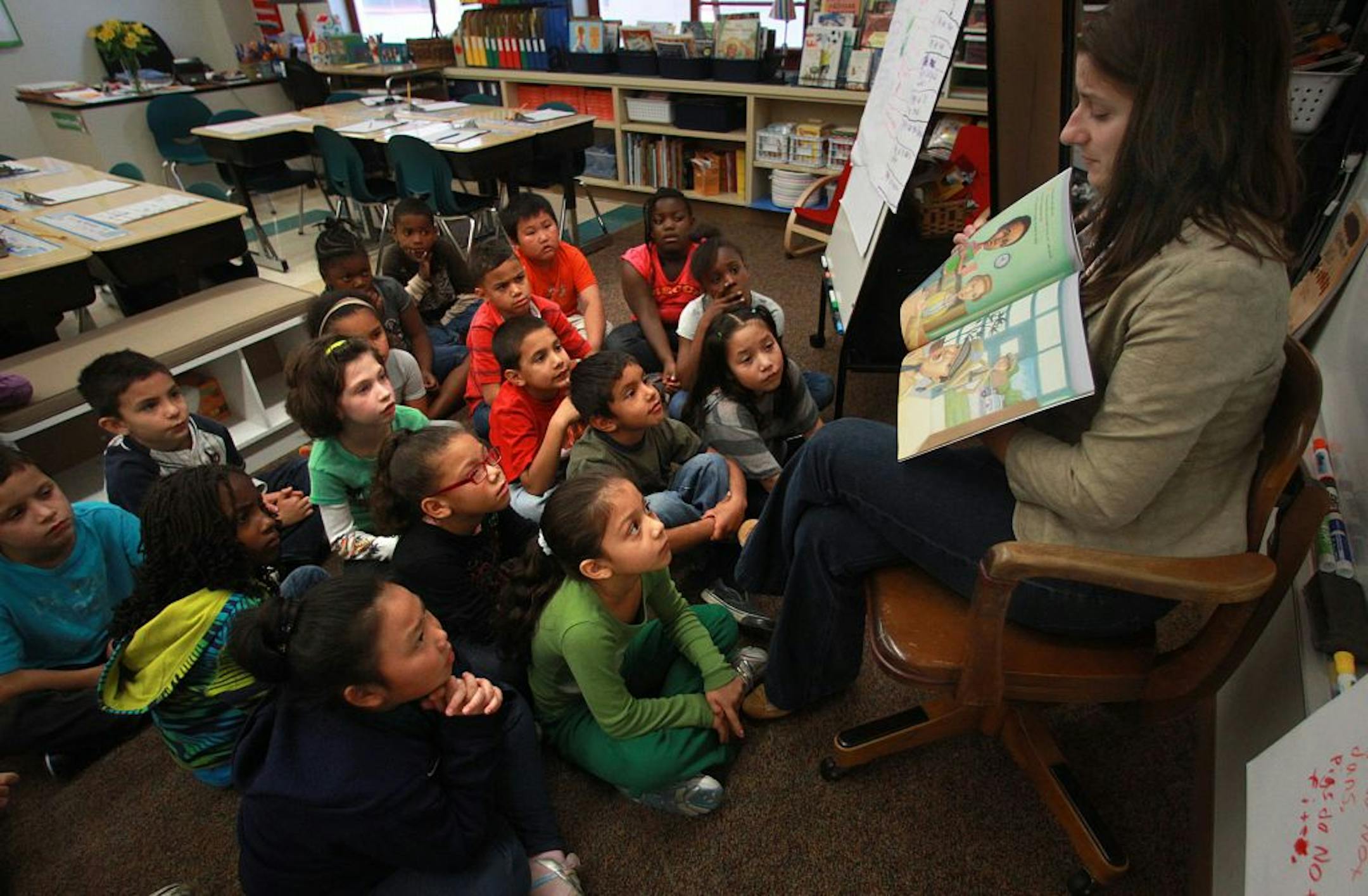 Licensed resource teacher Olivia Stewart read a story, "Ron's Big Mission," to second grade students at Earle Brown Elementary School in Brooklyn Center last September. Earle Brown failed to meet the No Child Left Behind goal in 2011 and was preparing for restructuring.