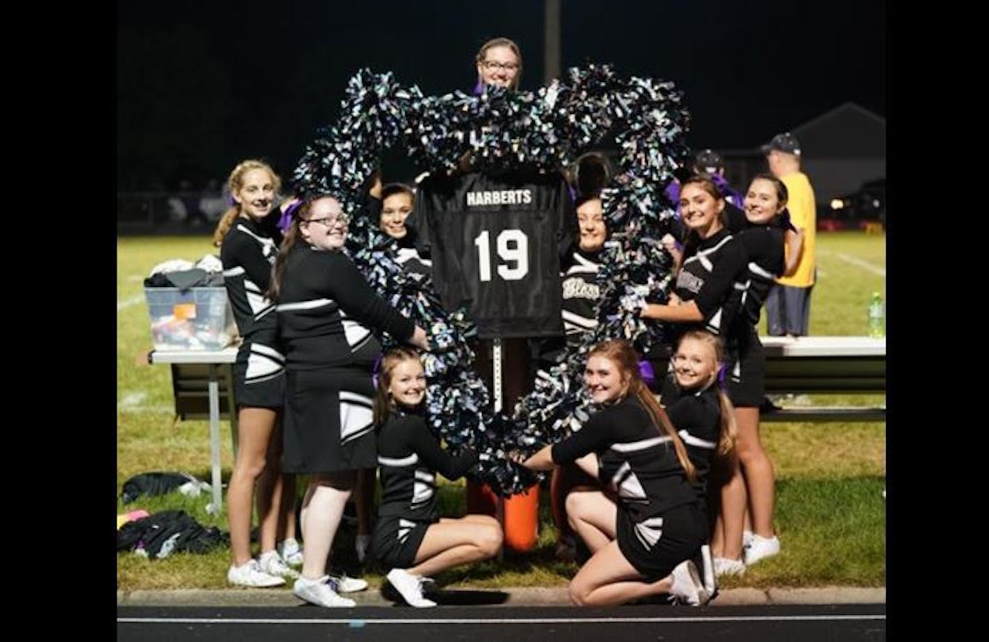 Cheerleaders for Blooming Prairie High School surrounded this display during the football team's home game last week.