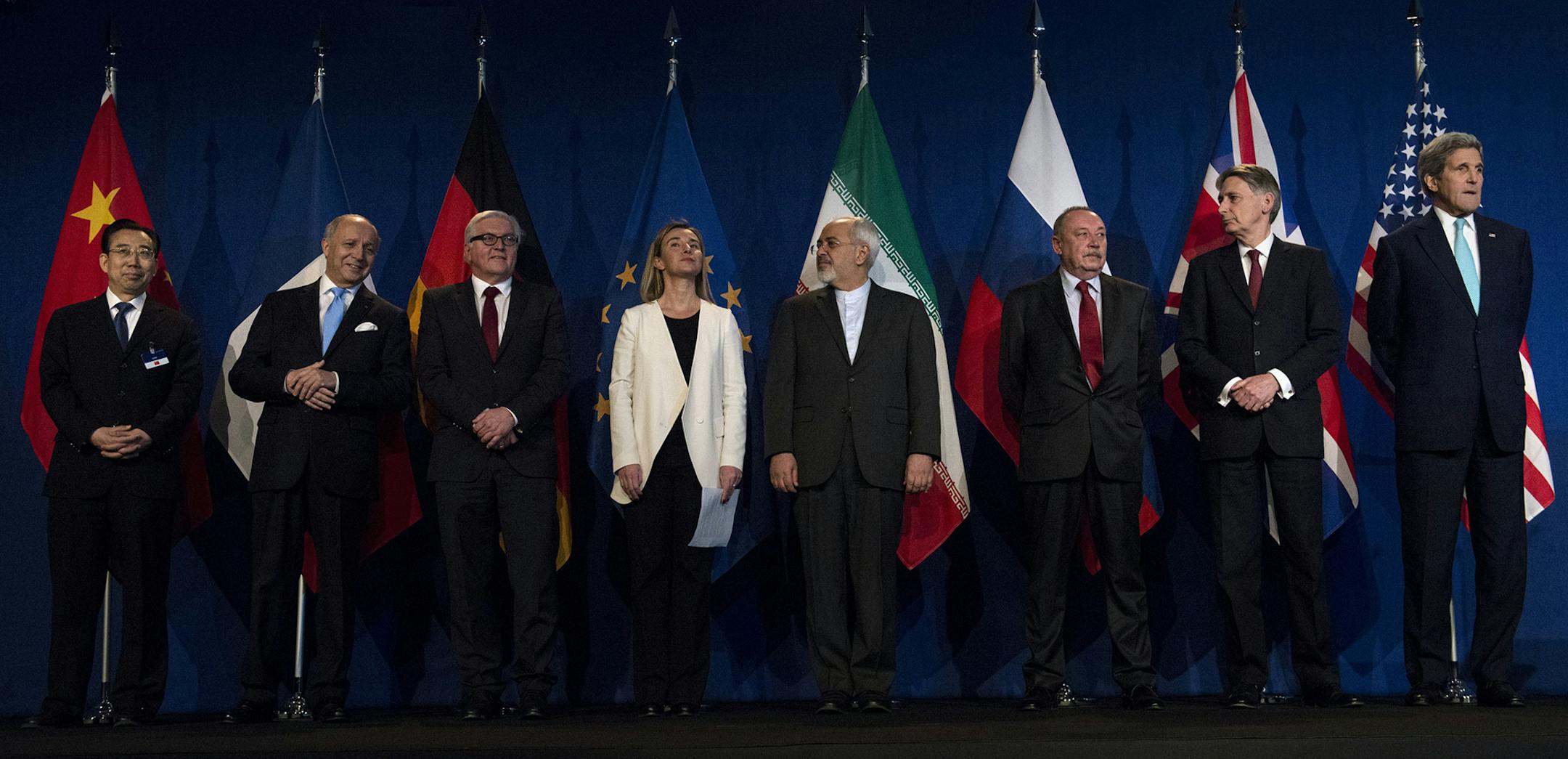 From left, Head of Mission of People's Republic of China to the European Union Hailong Wu, French Foreign Minister Laurent Fabius, German Foreign Minister Frank Walter Steinmeier, European Union High Representative for Foreign Affairs and Security Policy Federica Mogherini, Iranian Foreign Minister Javad Zarifat, an unidentified Russian official, British Foreign Secretary Philip Hammond and US Secretary of State John Kerry arrive, at the Swiss Federal Institute of Technology, or Ecole Polytechni