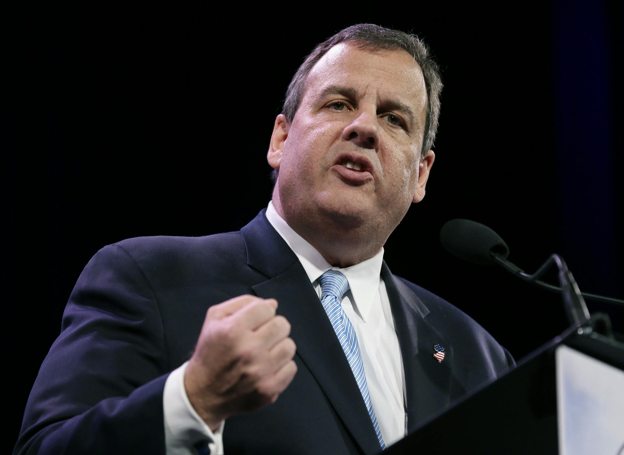 In this Jan. 24, 2015, photo, New Jersey Gov. Chris Christie speaks during the Freedom Summit in Des Moines, Iowa. Mitt Romney’s exit from the 2016 race for president unleashed a frenzy of fresh fundraising and has set off a new race for the backing of donors who had remained loyal to the last Republican nominee. (AP Photo/Charlie Neibergall)