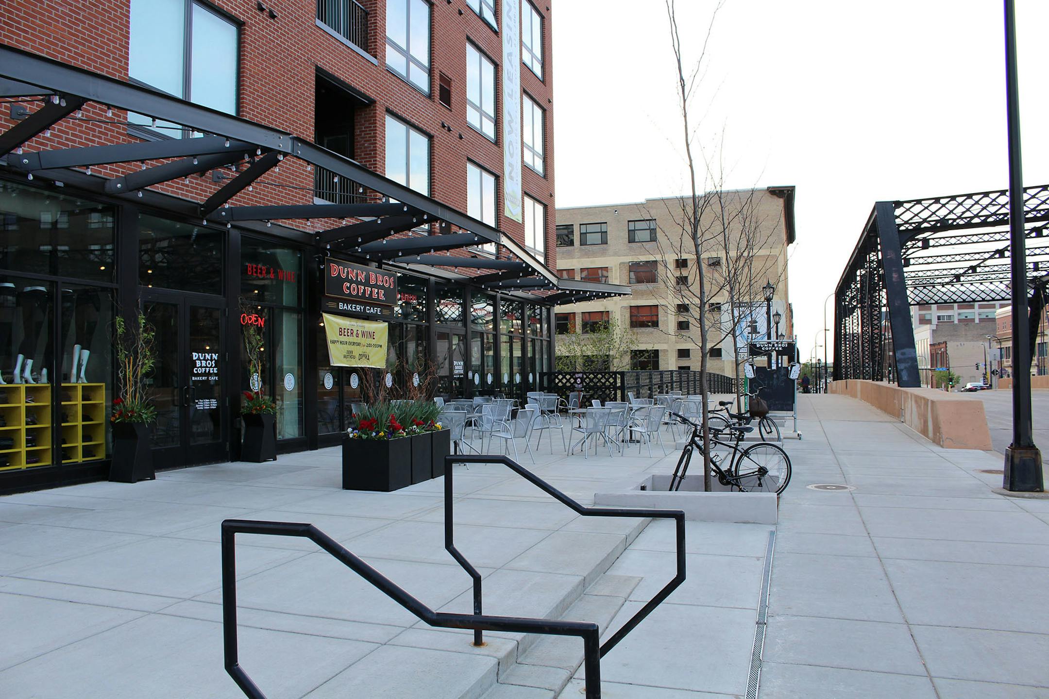 The Washington Avenue side of the new Dock Street Flats was deemed a success. the building's ample spacing from the sidewalk allowed for an outdoor Dunn Brothers patio, Newberg said, while the modest retail spaces are an approachable mix of windows and doorways.