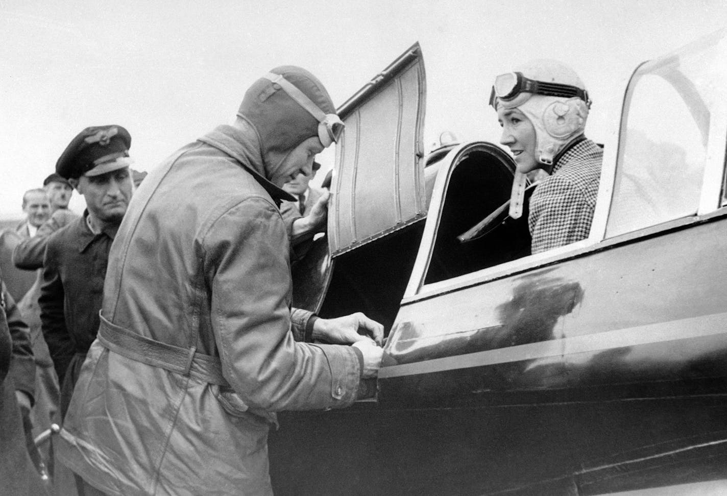 Colonel Charles Lindbergh and his wife Anne Morrow Lindbergh as they arrived at Tempelphof Aerodrome in Berlin, Germany by air on Oct. 11, 1938, from Rotterdam. Lindbergh is to attend the annual meeting of the Lilienthal Society for Aviation Research, was accused of Fascist sympathies by a group of Russian airmen in a Moscow newspaper. (AP Photo) ORG XMIT: APHSL45206