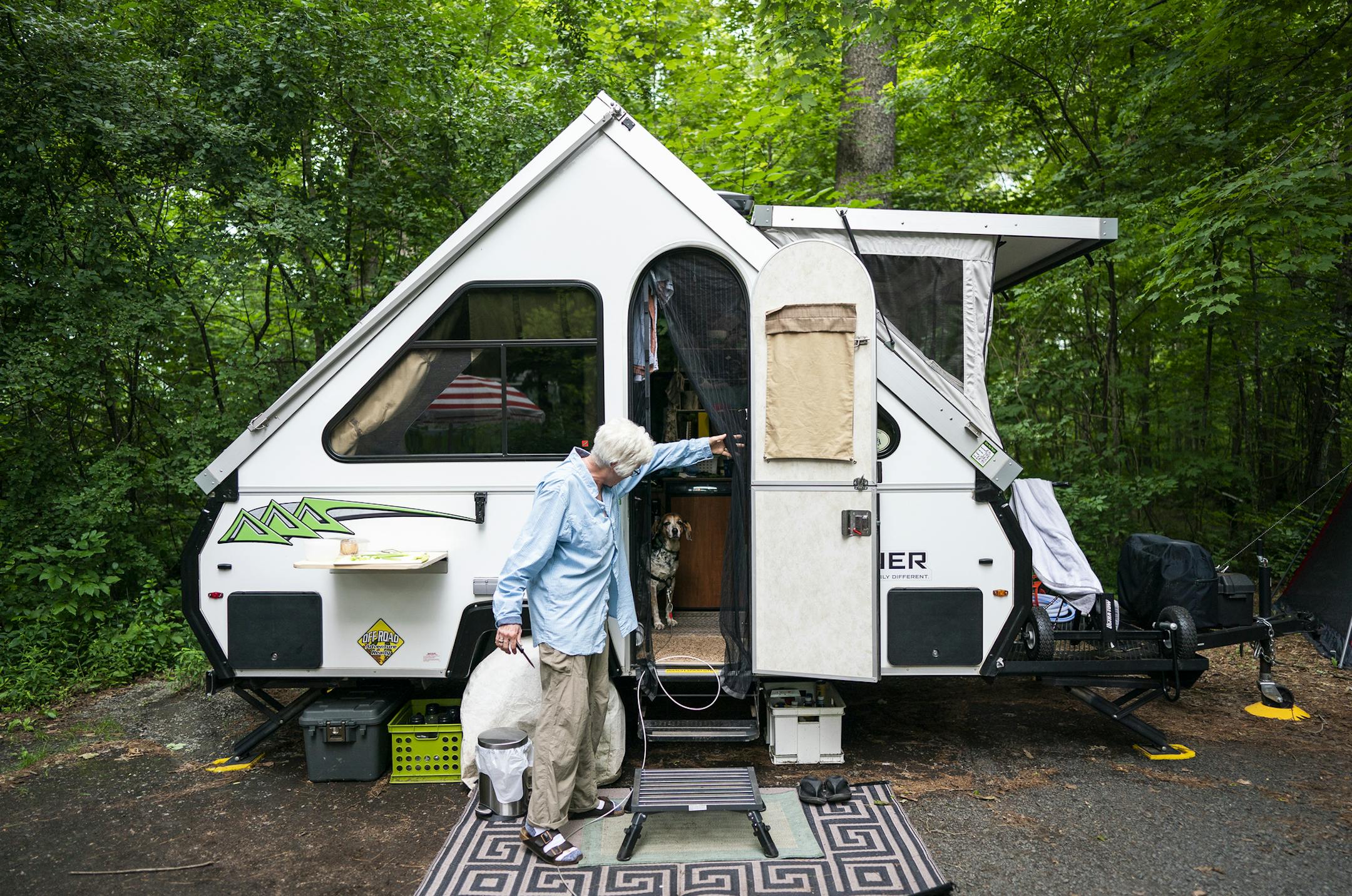 Polly West stands outside her A-frame pop-up camper. ] LEILA NAVIDI • leila.navidi@startribune.com BACKGROUND INFORMATION: The Lyte Hearts chapter of the national group RVing Women camp together at William O'Brien State Park in Marine on St. Croix on Thursday, July 18, 2019.