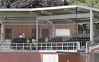Workers install the last few seats in the new grandstand at Tink Larson Community Field Tuesday in Waseca. More than two years after the old grandstan