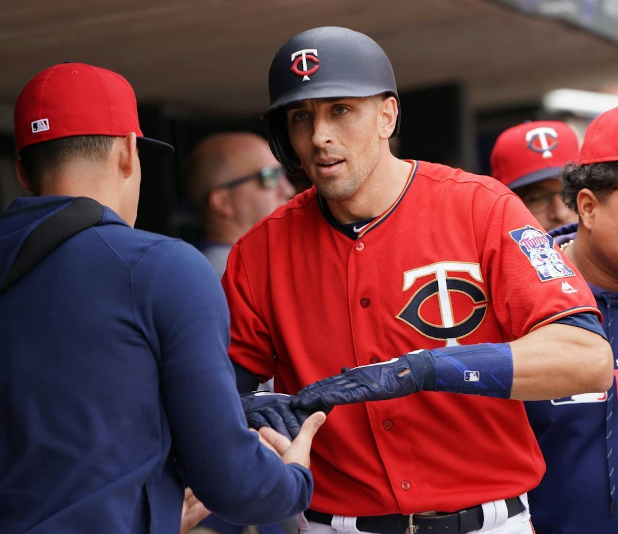 Minnesota Twins catcher Jason Castro (15) was congratulated in the dugout after hitting his fifth homerun of the season in the sixth inning.