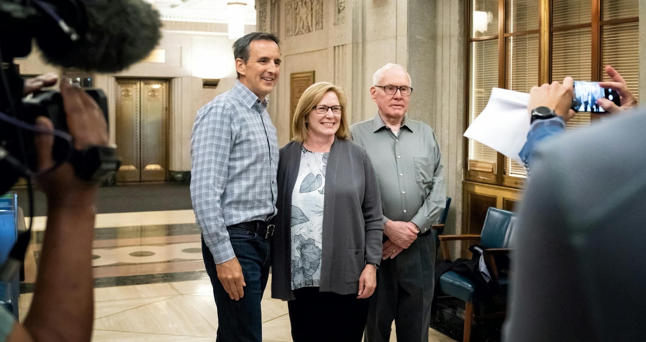 Former Gov. Tim Pawlenty announced Lt. Governor Michelle Fischbach as running mate as he runs for a third term. After the announcement they posed for a photo with Lt. Governor Fischbach's father Tom St. Martin.