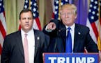 Republican presidential candidate Donald Trump, accompanied by New Jersey Gov. Chris Christie, left, takes questions from members of the media during 