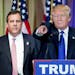 Republican presidential candidate Donald Trump, accompanied by New Jersey Gov. Chris Christie, left, takes questions from members of the media during 