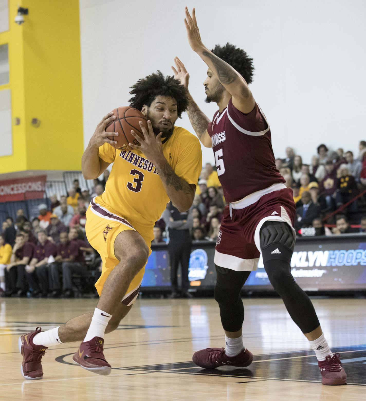 Minnesota forward Jordan Murphy (3) drives to the basket against UMass forward Chris Baldwin (5) during the first half of an NCAA college basketball game, Friday, Nov. 24, 2017, in New York. (AP Photo/Mary Altaffer)