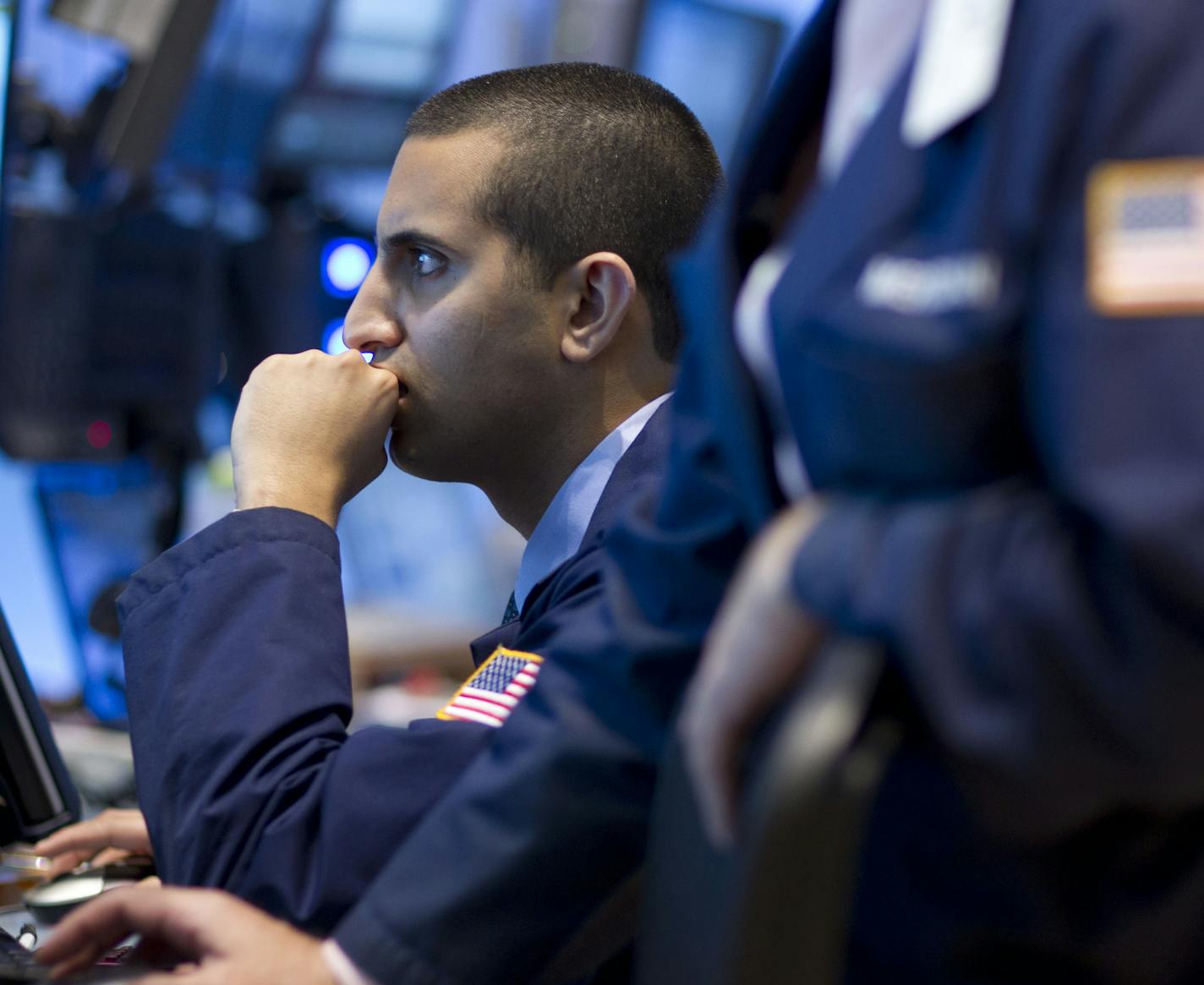 A trader works on the floor of the New York Stock Exchange on Friday, Sept. 2, 2011 in New York. The jobs report was the weakest in almost a year. It renewed fears that the U.S. might slip back into recession. (AP Photo/Jin Lee)