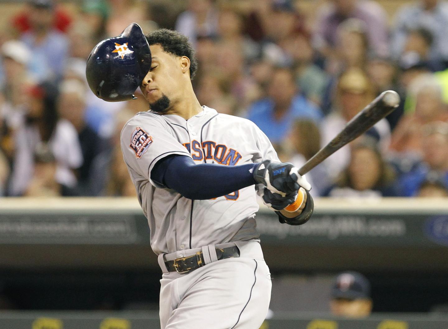 Houston Astros' Carlos Gomez loses his batting helmet as he swings for a strike against Minnesota Twins starting pitcher Kyle Gibson during the fourth inning of a baseball game in Minneapolis, Friday, Aug. 28, 2015. (AP Photo/Ann Heisenfelt)