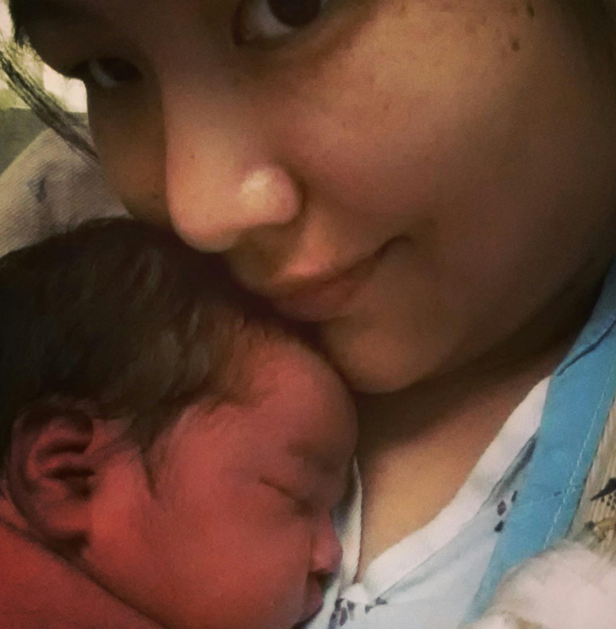 This undated cell phone picture provided by Trish Staine shows Staine, right, with her newborn baby, in Duluth, Minn. Staine, a 33-year-old aspiring half-marathon runner, says she had no idea she was pregnant before giving birth Monday, June 5, 2013. (AP Photo/Patricia Staine) ORG XMIT: MIN2013060517151988