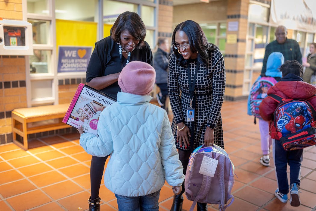New superintendent of Minneapolis Public Schools, Lisa Sayles-Adams, right, and Nellie Stone Johnson Elementary School Principal Kelly Wright, left, greeted students.