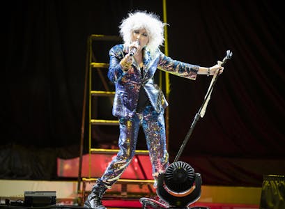 Wearing a multi-colored sequined pantsuit, Cyndi Lauper delivered a powerful and provocative set.