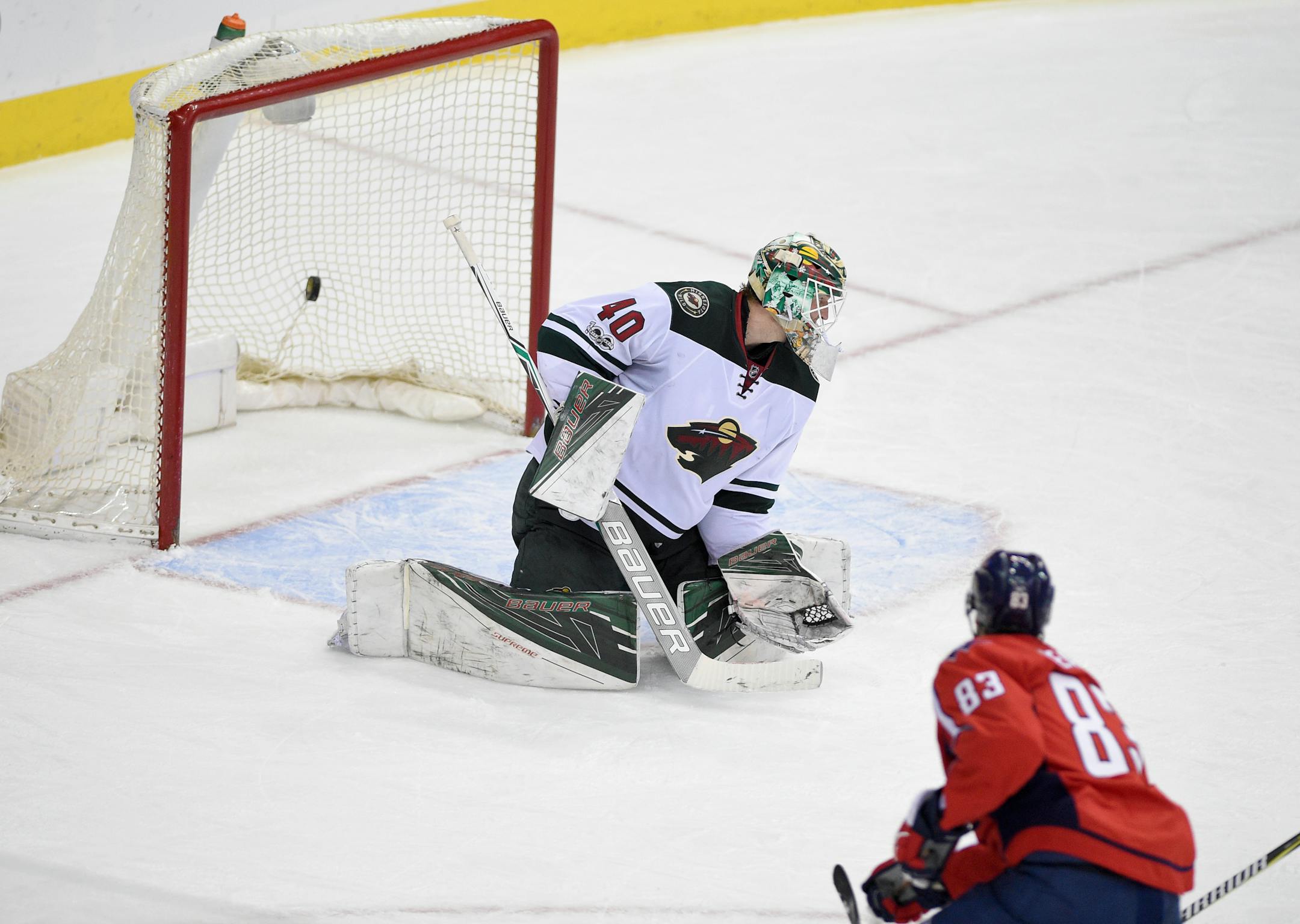 Washington Capitals center Jay Beagle (83) scores a goal past Minnesota Wild goalie Devan Dubnyk (40) during the third period of an NHL hockey game, Tuesday, March 14, 2017, in Washington. The Capitals won 4-2. (AP Photo/Nick Wass)