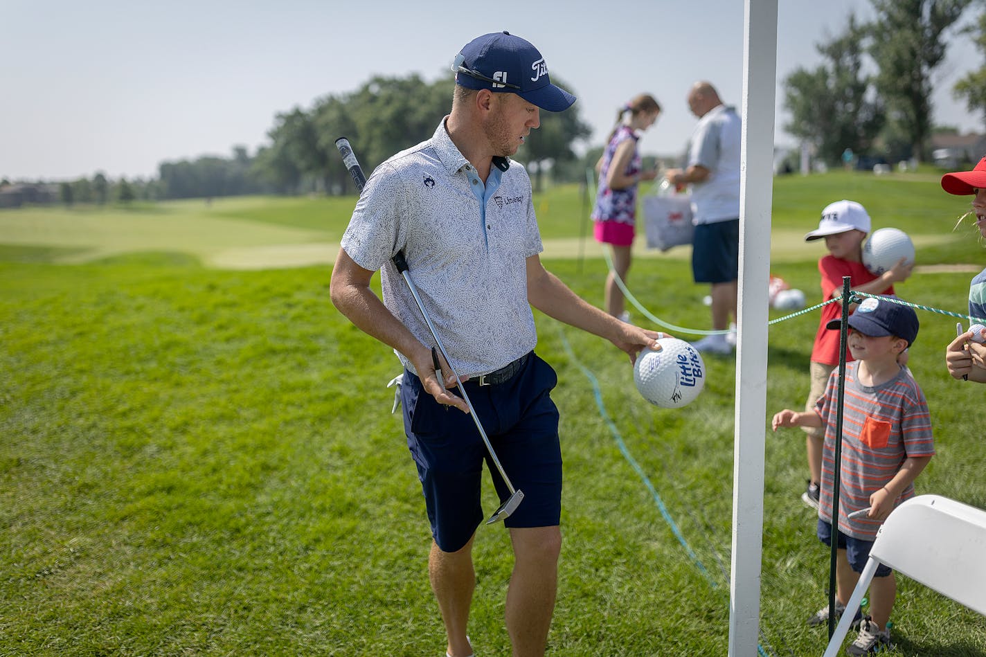 Justin Thomas signs autographs for young fans at the PGA Tour's 3M Open in Blaine, Minn., on Tuesday, July 25, 2023. ] Elizabeth Flores • liz.flores@startribune.com