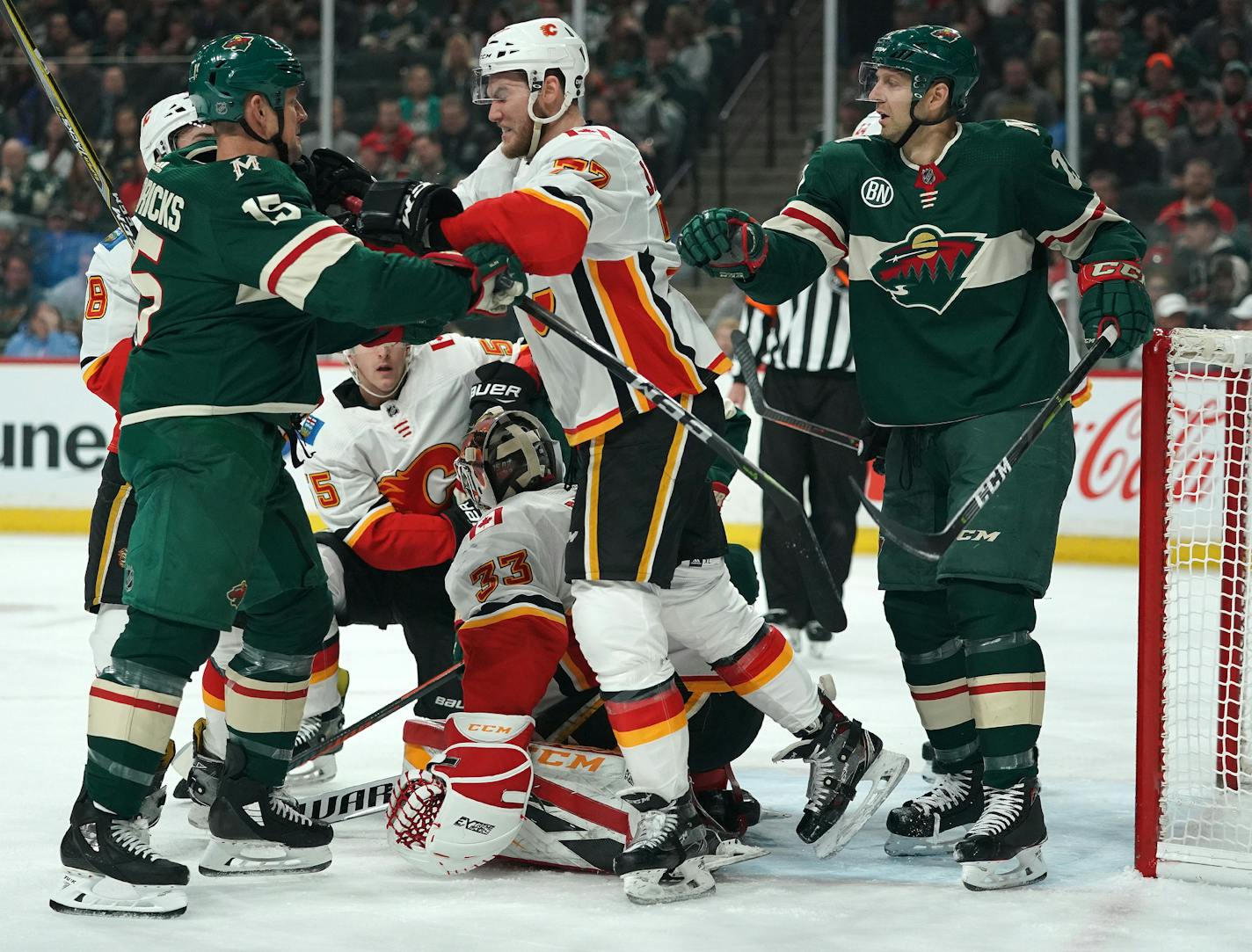 Minnesota Wild center Matt Hendricks (15) scrapped with Calgary Flames center Mark Jankowski (77) near the Calgary Flames goal in the first period. ] ANTHONY SOUFFLE &#xef; anthony.souffle@startribune.com The Minnesota Wild played the Calgary Flames in an NHL game Saturday, Dec. 15, 2018 at the Xcel Energy Center in St. Paul, Minn.