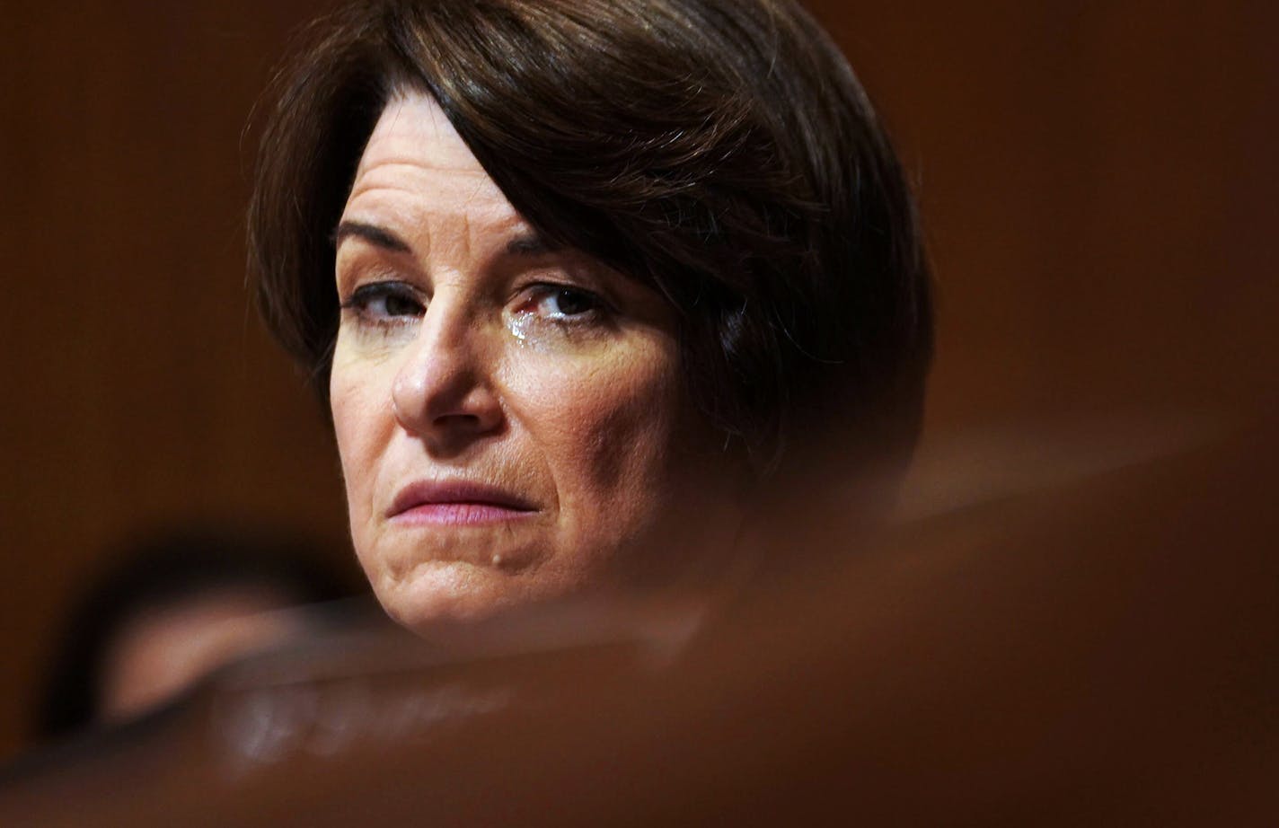 Sen. Amy Klobuchar (D-Minn.) fights back tears as the Senate Judiciary Committee prepares to vote on the nomination of Judge Brett Kavanaugh to the Supreme Court on Friday, Sept. 28, 2018. Sen. Jeff Flake (R-Ariz.), the lone swing Republican vote on the Judiciary Committee, said Friday morning that he would vote to confirm Kavanaugh, ensuring committee passage and bringing President Donald Trump&#xed;s nominee to the brink of confirmation less than 24 hours after a remarkable public hearing with