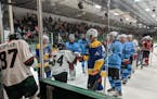 NHL players in Da Beauty League formed a tunnel for on-ice introductions of Minnesota Special Hockey players during the Unified Showcase on Monday, Au