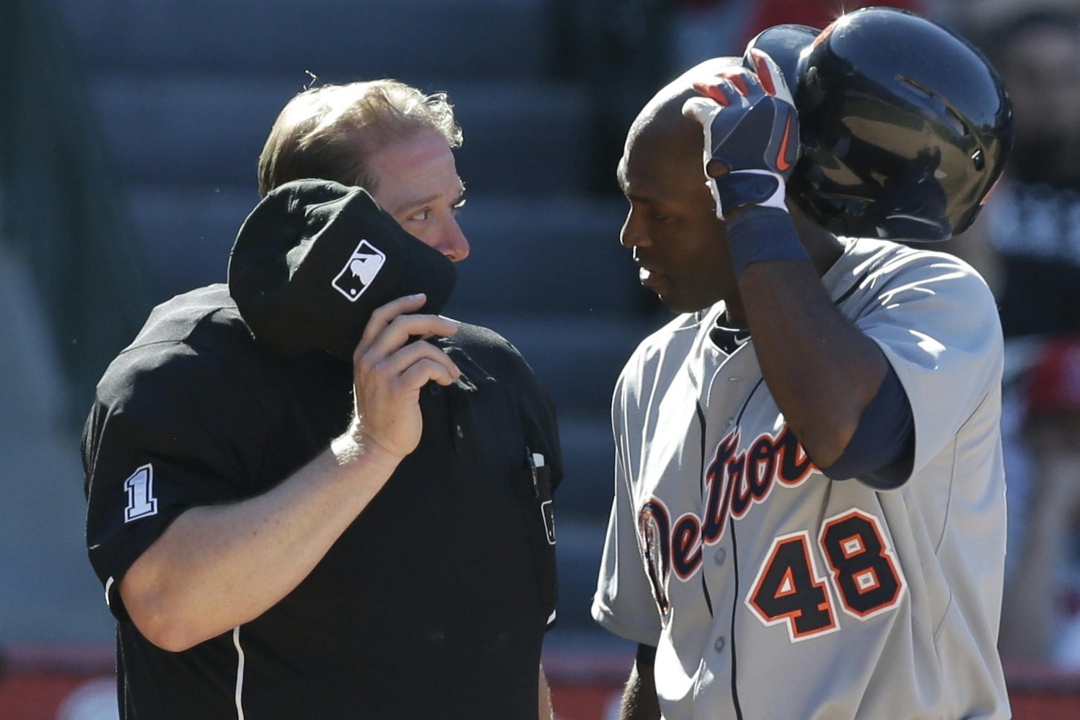Detroit Tigers' Torii Hunter, right talks with home plate umpire Bruce Dreckman during a baseball game against the Los Angeles Angels in Anaheim, Calif., Sunday, April 21, 2013. (AP Photo/Chris Carlson)
