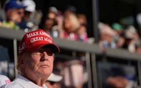 Republican presidential candidate, former President Donald Trump watches play on the 18th hole in the final round of LIV Golf Miami, at Trump National