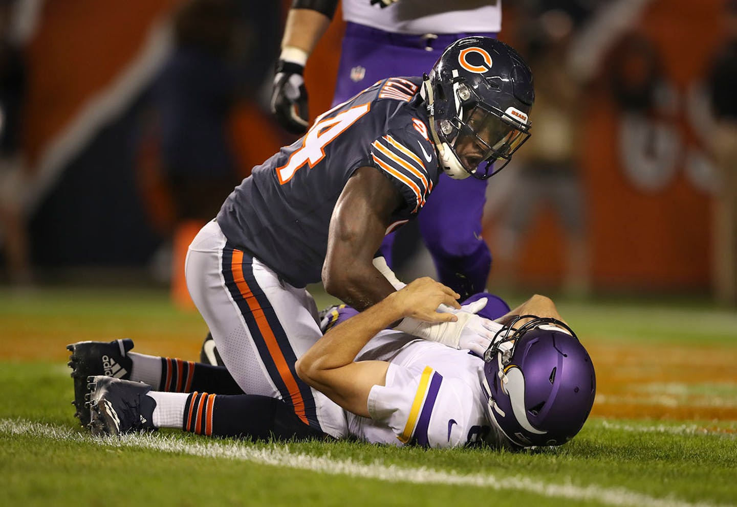 Minnesota Vikings quarterback Sam Bradford (8) was sacked in the end zone by Chicago Bears outside linebacker Leonard Floyd (94) for a safety in the first quarter.