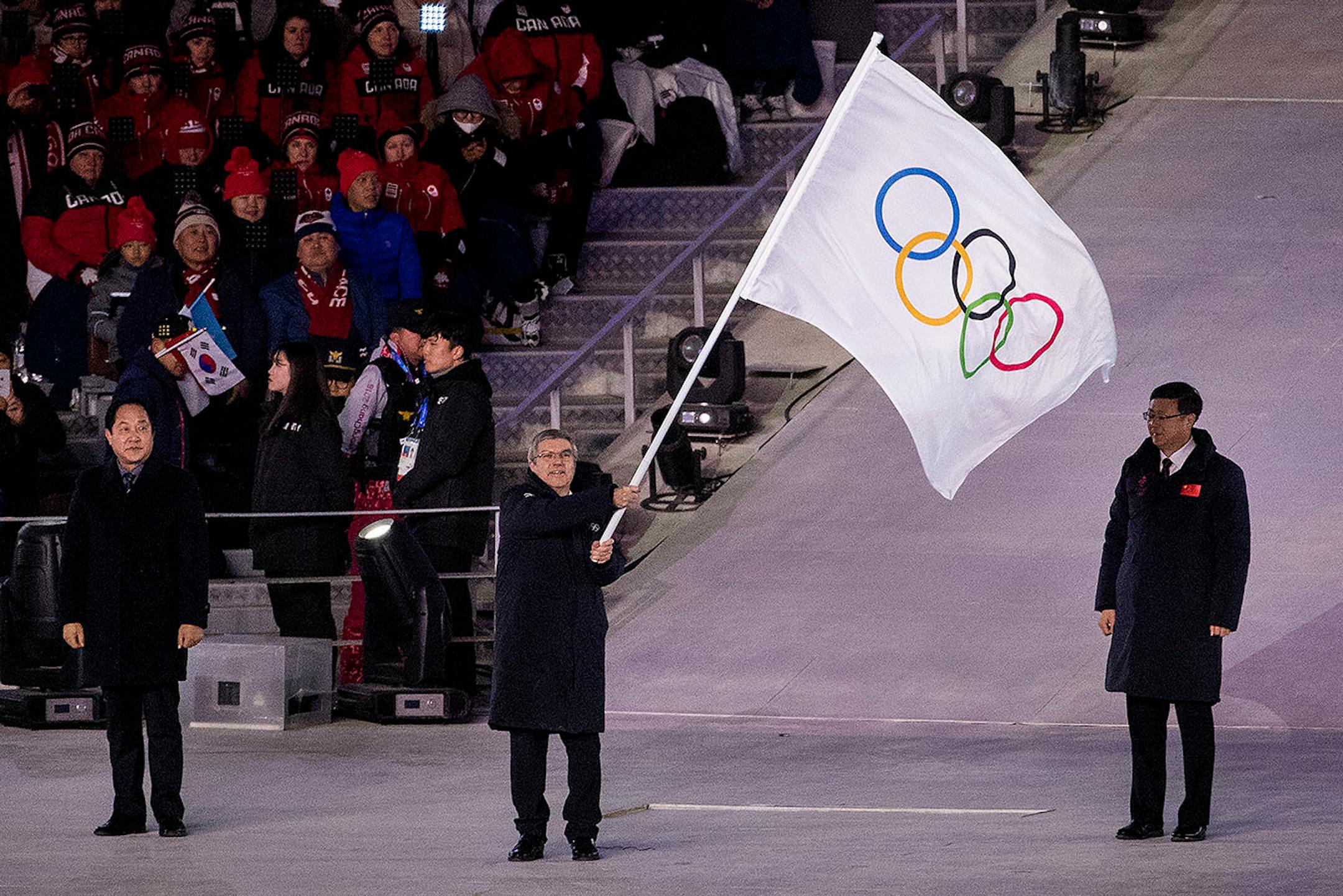 IOC President Thomas Bach waved the Olympic flag at Pyeongchang Olympic Stadium during Closing Ceremony on Sunday.