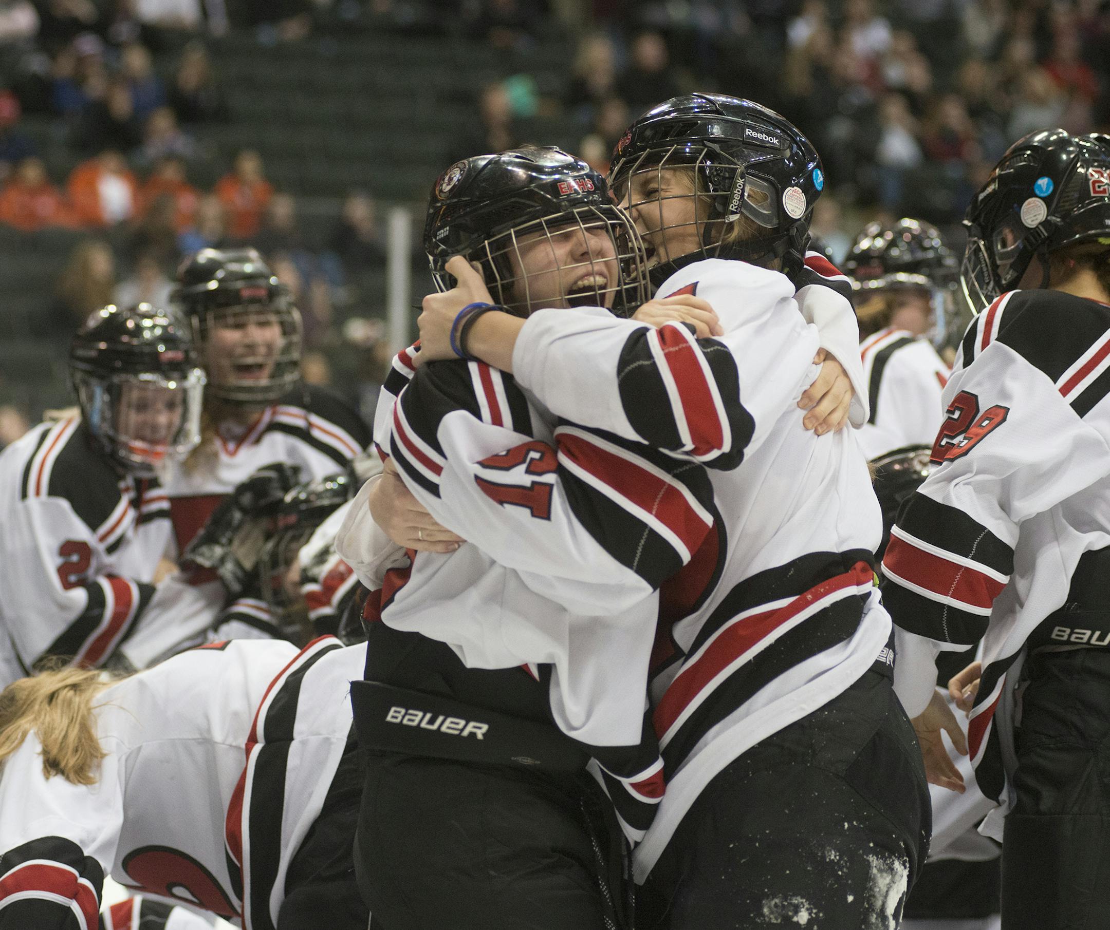 Eden Prairie's Kasandra Bienkowski and Kate Pearson celebrate with the rest of the Eden Prairie girls' team after winning the Girls' Class 2A State Hockey Championship, Feb. 20, 2016, at the Xcel Energy Center in St. Paul, MN. ] (Matthew Hintz, 022016, St. Paul)