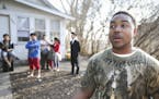 Donnell Gibson, left, pulled over and rushed into a house he noticed was on fire when he saw three bewildered children on the front stoop. Then Gibson