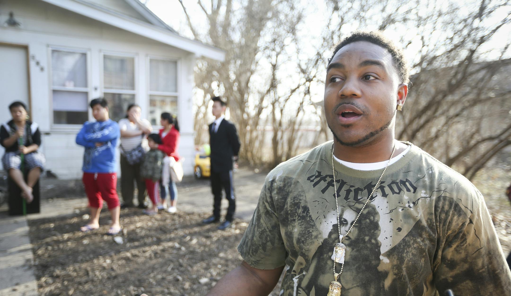 Donnell Gibson, left, pulled over and rushed into a house he noticed was on fire when he saw three bewildered children on the front stoop. Then Gibson rallied the other members in the house to leave. He was photographed at the scene in St. Paul, Minn., on Wednesday, April 1, 2015. ] RENEE JONES SCHNEIDER • reneejones@startribune.com