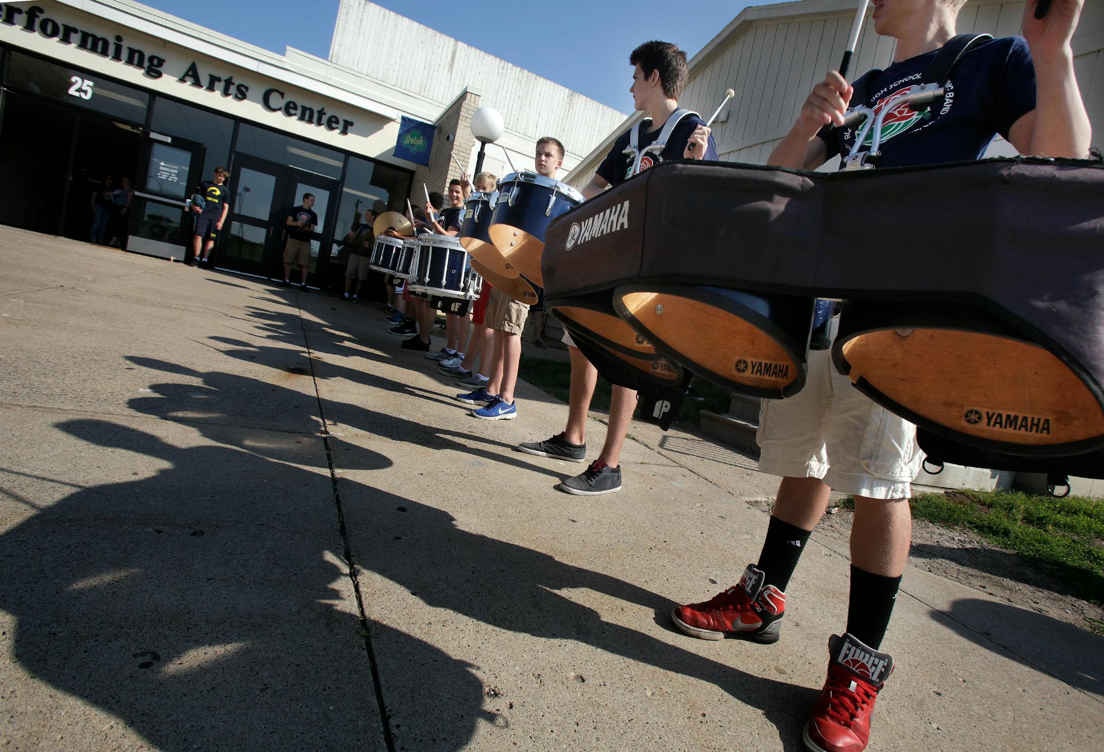 The Marching band practices for the arrival of the President of the Tournament of Roses' Scott Jenkins and his wife Cindy Jenkins at Rosemount High School on July 12, 2013.