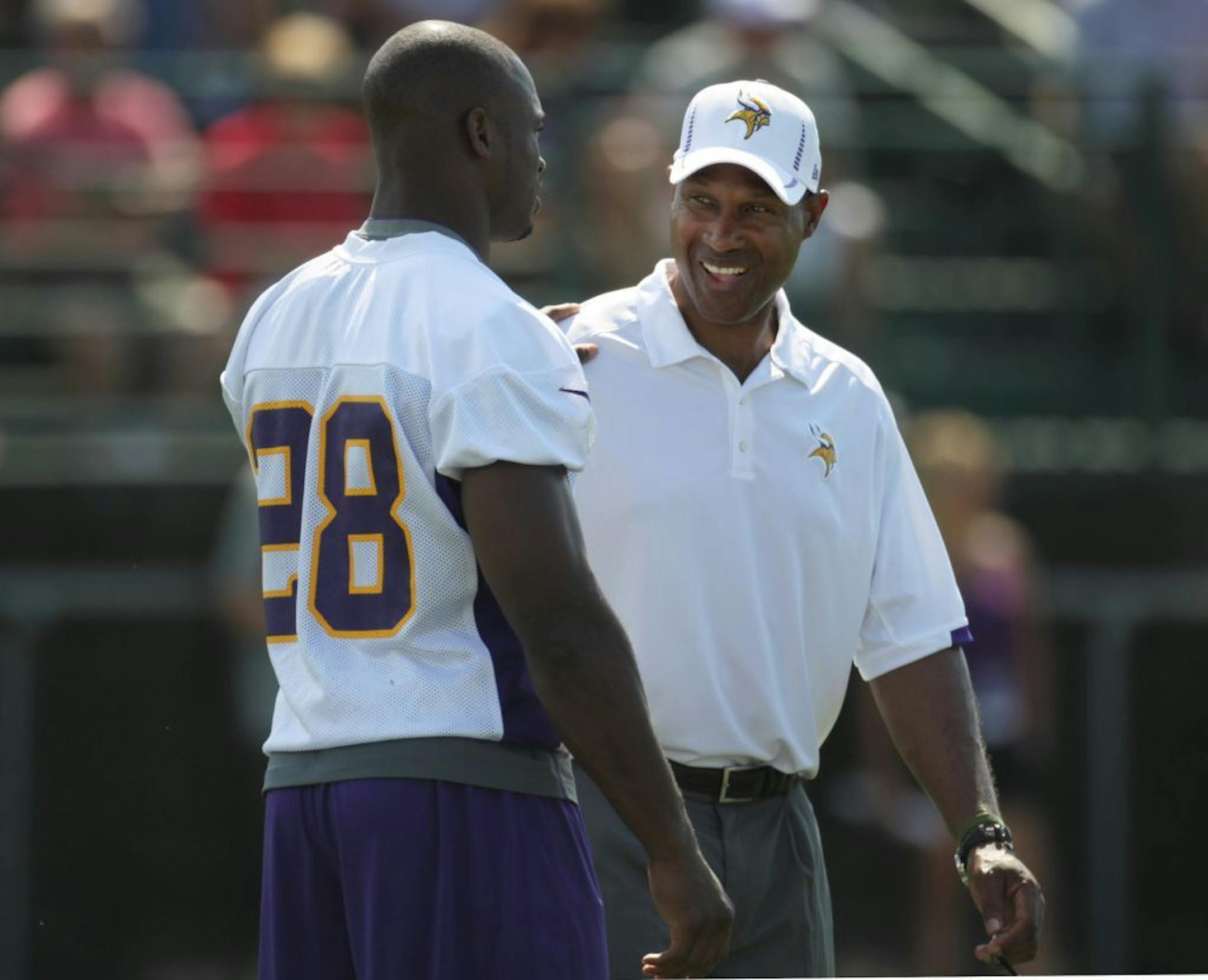 Former Vikings head coach Leslie Frazier Adrian Peterson at training camp in 2012.