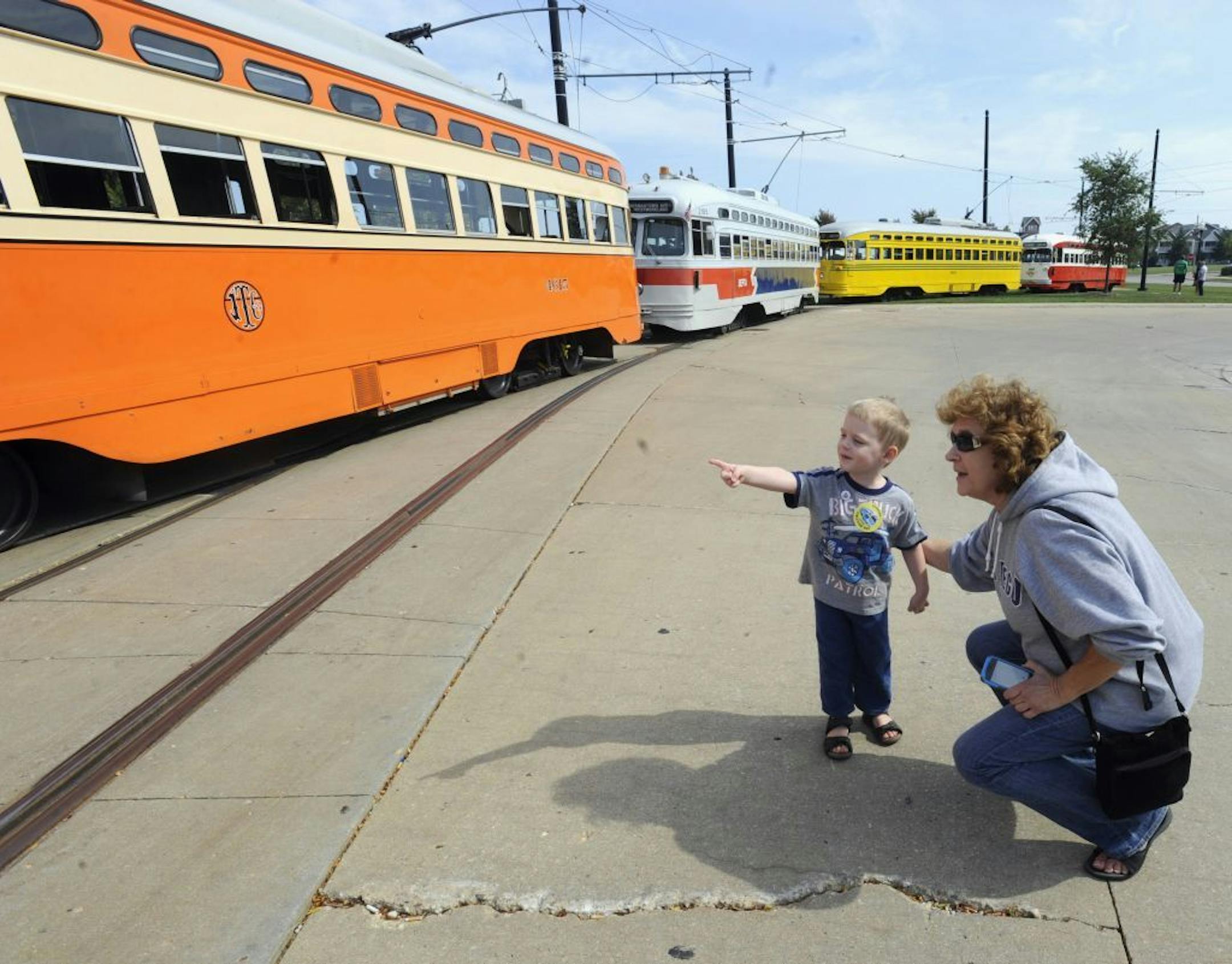 Johnathan Sainski, 2, of Wheatland, Wis., points out his favorite streetcar to his grandmother Anna Sainski, of Bristol, Wis., during Kenosha Streetcar Day outside the Joseph McCarthy Transit Center in Kenosha, Wis.