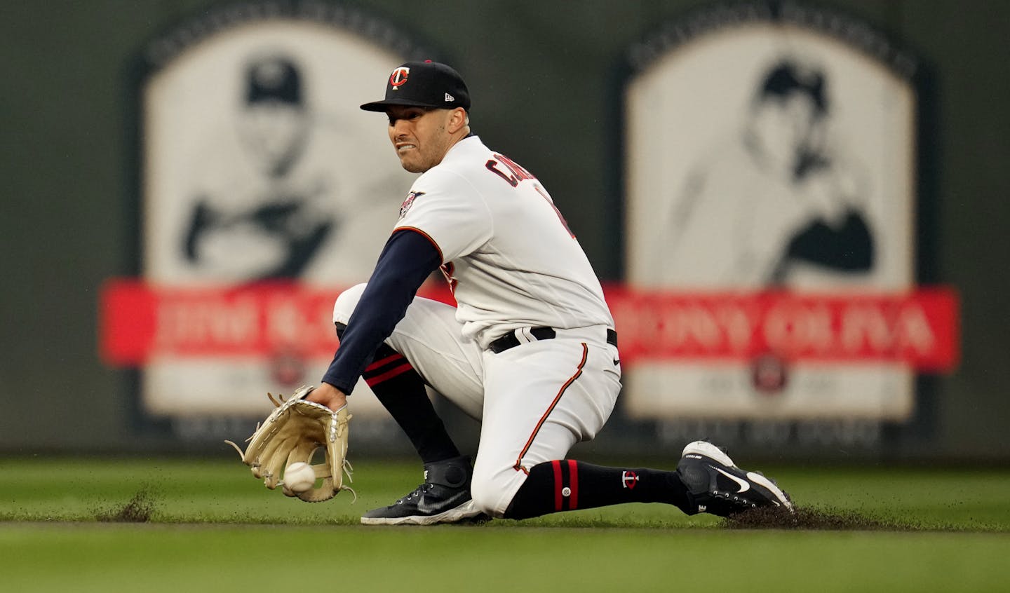 Minnesota Twins shortstop Carlos Correa (4) scopes up a ball hit by Los Angeles Dodgers shortstop Trea Turner (6) for an out in the first inning in Minneapolis, Minn., on Tuesday, April 12, 2022.