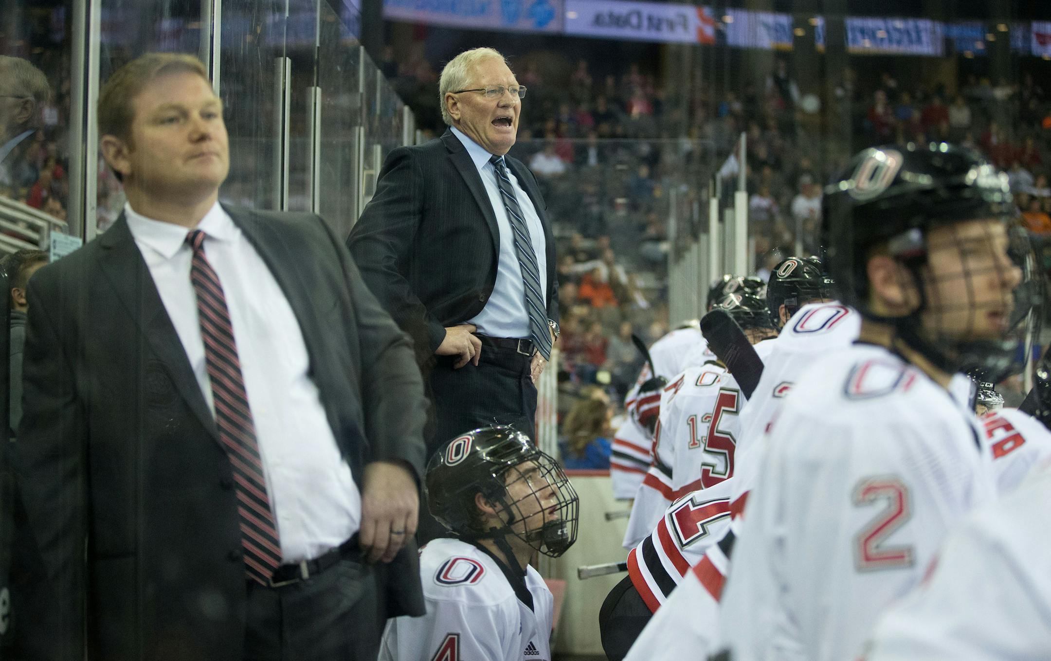 OMAHA, NE - UNO head coach Dean Blais stands on the bench for a better view in the second period as UNO beat St. Cloud St. 3-2 at the CenturyLink Center in Omaha, Neb., on Friday, Dec. 12, 2014. It was Blais' 100th win as a Mav coach. MARK DAVIS/THE WORLD-HERALD