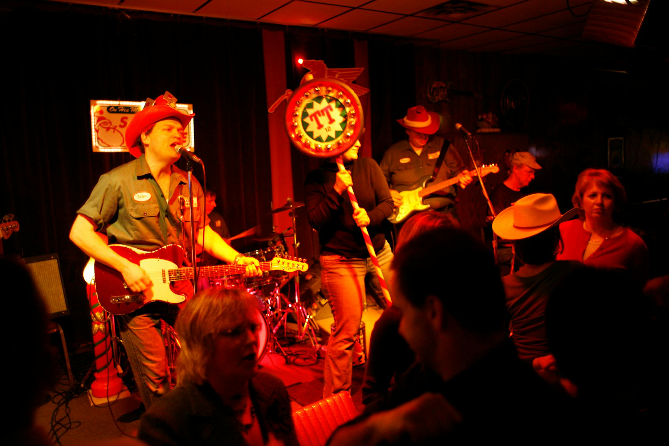 Trailer Trash singer/guitarist Nate Dungan, left, flanked by the fabled Jingle Stick, leads a prior year's Trashy Little Xmas concert at Lee's Liquor Lounge.