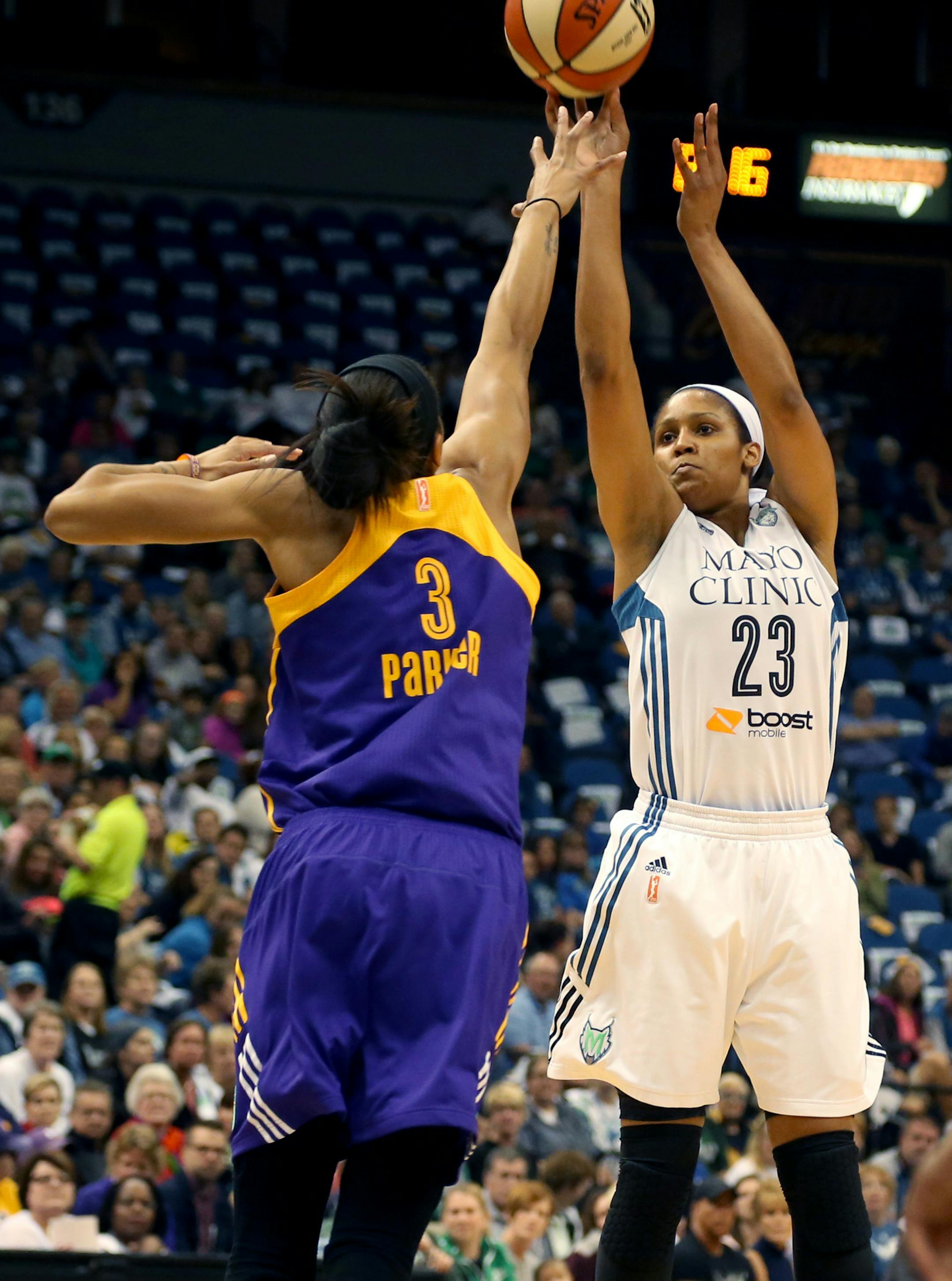 Lynx Maya Moore went up for her jumper against the Sparks Candice Parker during the first quarter. ] (KYNDELL HARKNESS/STAR TRIBUNE) kyndell.harkness@startribune.com Lynx vs LA Sparks during the first round of the WNBA Playoffs at Target Center in Minneapolis Min., Friday September 18, 2015.