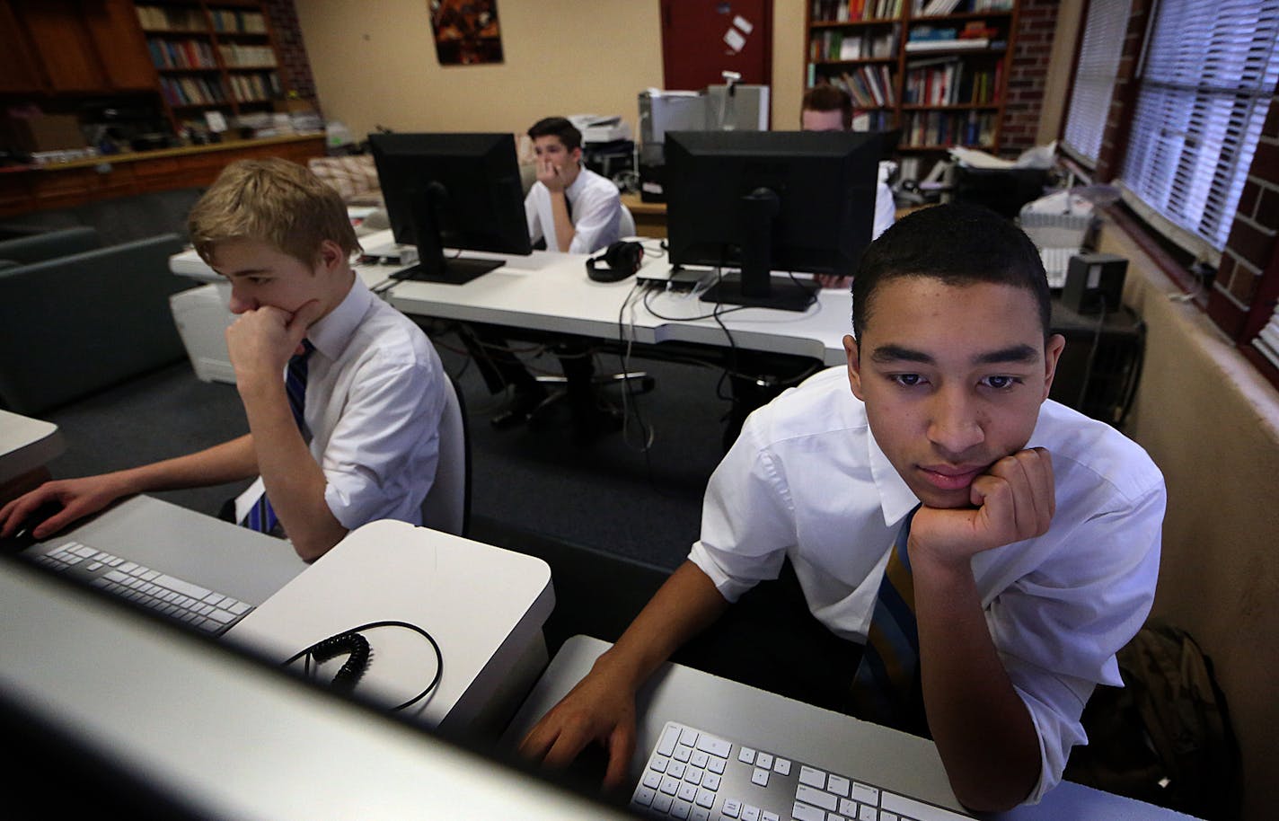 Ninth graders Mccaleb Alleman (right) and Kiernan Johnston, both 15, concentrated while working in the computer lab at CHOF. ] JIM GEHRZ &#xef; james.gehrz@startribune.com /St. Paul and Minneapolis, MN / February 23, 2016 /10:30 AM &#xf1; BACKGROUND INFORMATION: Christ&#xed;s Household of Faith is a 21st century commune of nearly 500 members, including 200 children, who divest their assets when joining the church, live rent-free in its houses, and work unpaid for its businesses. The group filed