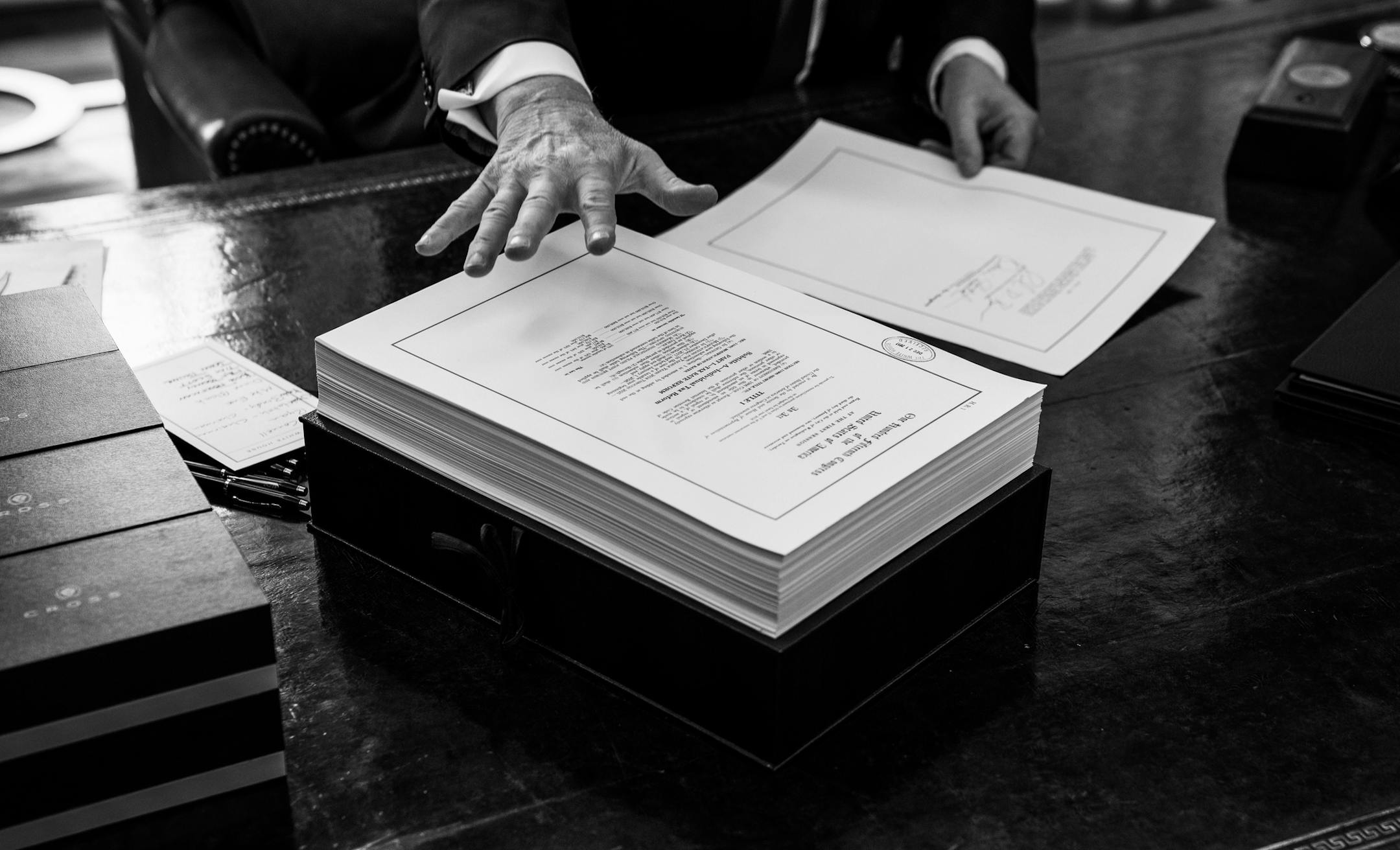 WASHINGTON -- BC-OPED-DERUGY-TAX-CODE-NYTSF -- President Donald Trump signs the tax reform bill in the Oval Office of the White House in Washington, Dec. 22, 2017. (Doug Mills/The New York Times) ONLY FOR USE WITH ARTICLE SLUGGED — BC-OPED-DERUGY-TAX-CODE-NYTSF — OTHER USE PROHIBITED
