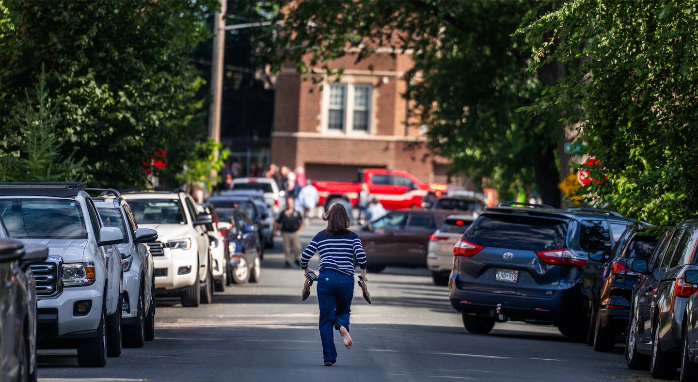 A parent runs to the school after reports of a shooting at Annunciation church in Minneapolis on Aug. 27, 2025. Two children, Harper Mojski, 10, and Fletcher Merkel, 8, were fatally wounded and 28 others were injured. The shooter also died from a self-inflicted gunshot. (Richard Tsong-Taatari/The Minnesota Star Tribune)