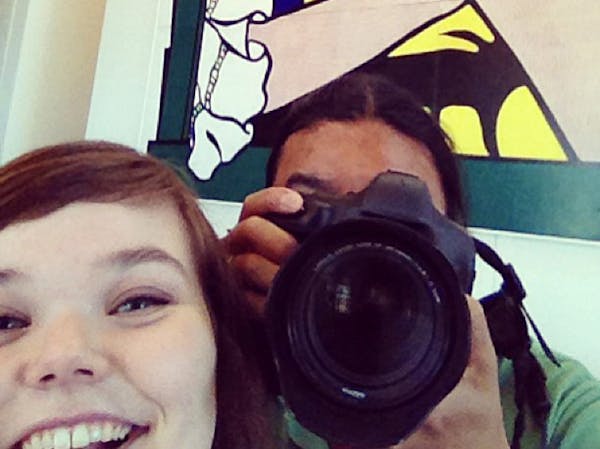Emma Strub takes a selfie while Star Tribune photographer Richard Tsong-Taatarii takes his own photo.