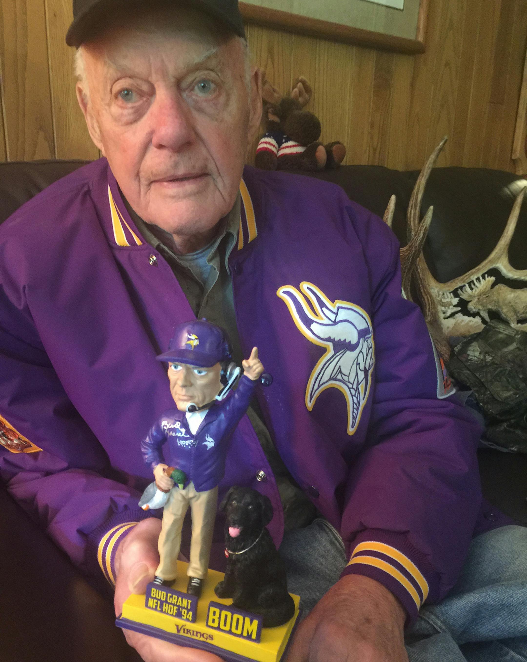 Bud Grant showed a bobblehead that features his old Labrador Retriever, Boom.