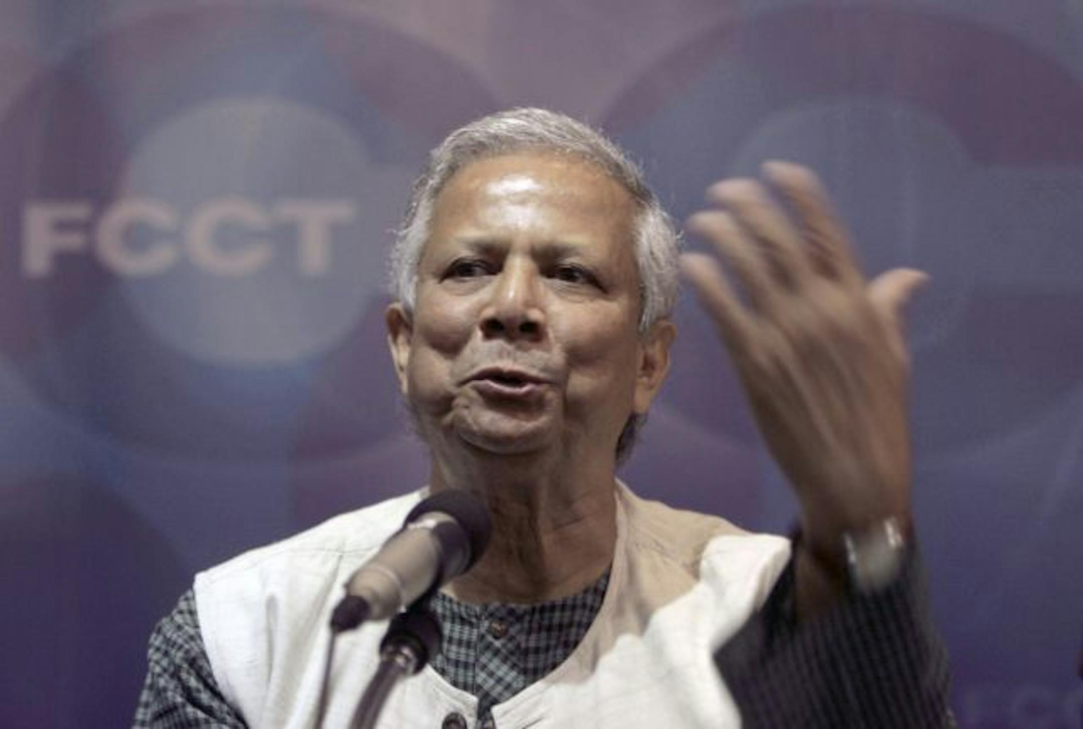 In this Wednesday, Aug. 19, 2009 photo, Nobel Peace laureate and a 2009 recipient of the Presidential Medal of Freedom from U.S. President Barack Obama, Muhammad Yunus gestures as he speaks at the Foreign Correspondents Club, in Bangkok, Thailand. The global financial crisis has highlighted a curious success story: A bank that doles out loans to some of the world's poorest, least creditworthy people continues to have a payback rate of nearly 100 percent. Yunus, known as the "banker to the poor,"