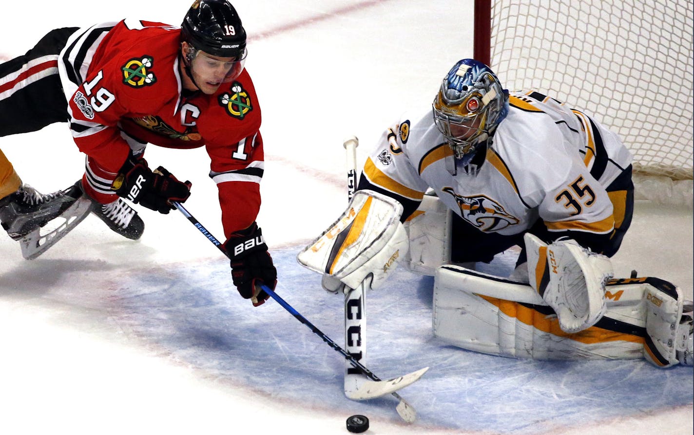 Blackhawks center Jonathan Toews clashed sticks with Predators goalie Pekka Rinne in a battle for the puck. Nashville swept Chicago in the first round.