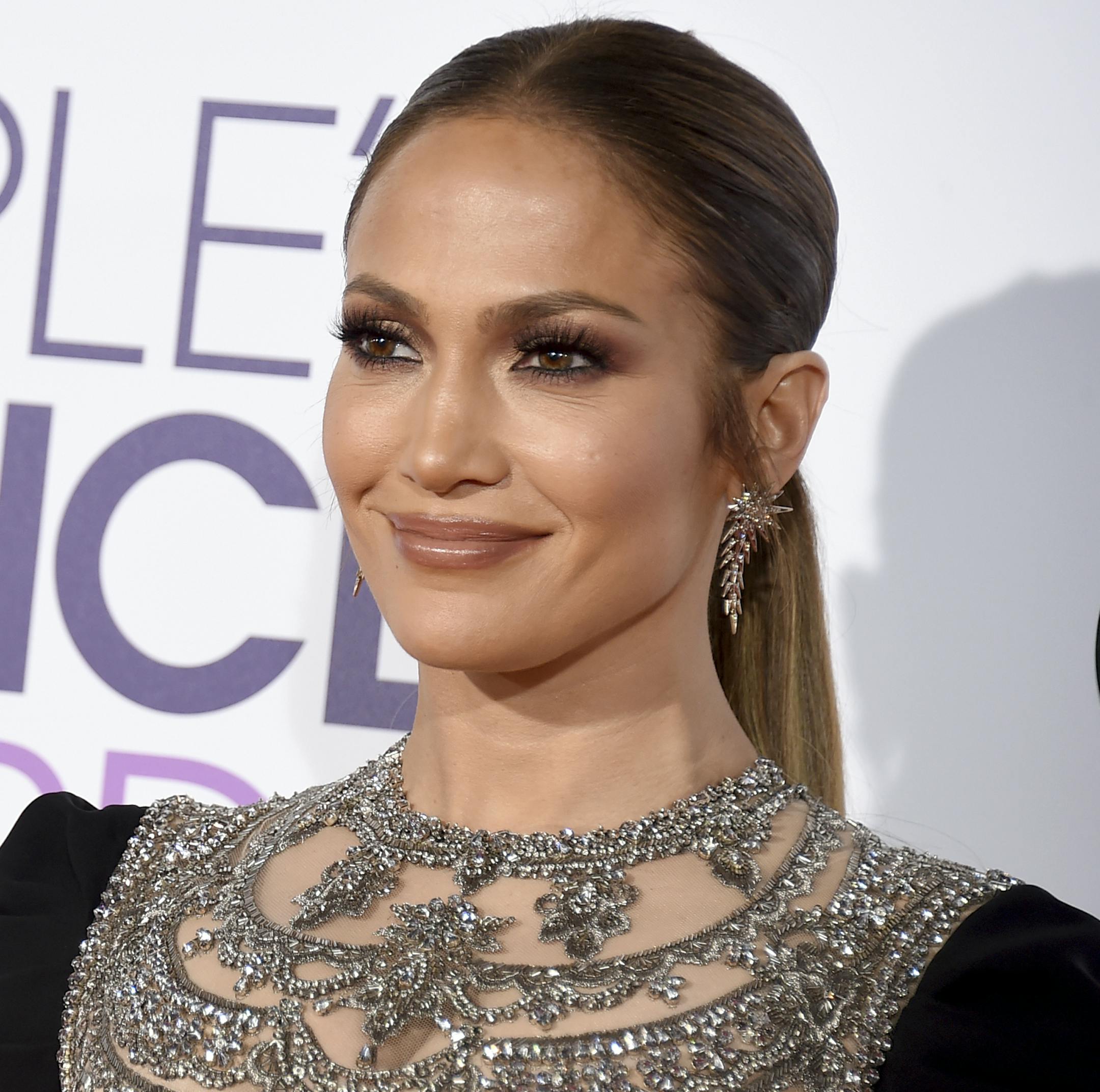 FILE - In this Jan. 18, 2017 file photo, Jennifer Lopez arrives at the People's Choice Awards at the Microsoft Theater, in Los Angeles. Back at spring training with the New York Yankees as a guest instructor, Alex Rodriguez watched part of an exhibition game against the Baltimore Orioles on Saturday, March 18, 2017 in a suite with singer-actress Jennifer Lopez. (Photo by Jordan Strauss/Invision/AP, File)