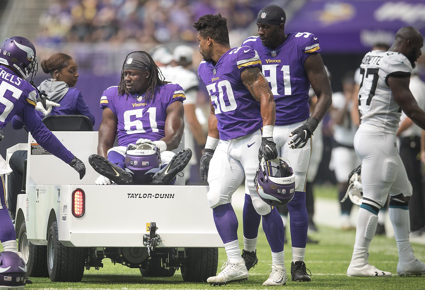 Vikings' defensive end Ade Aruna was greeted by teammates as he was taken off the field after an injury during the second quarter the Minnesota Vikings took on the Jacksonville Jaguars at US Bank Stadium, Saturday, August 18, 2018 in Minneapolis, MN. ] ELIZABETH FLORES &#xef; liz.flores@startribune.com