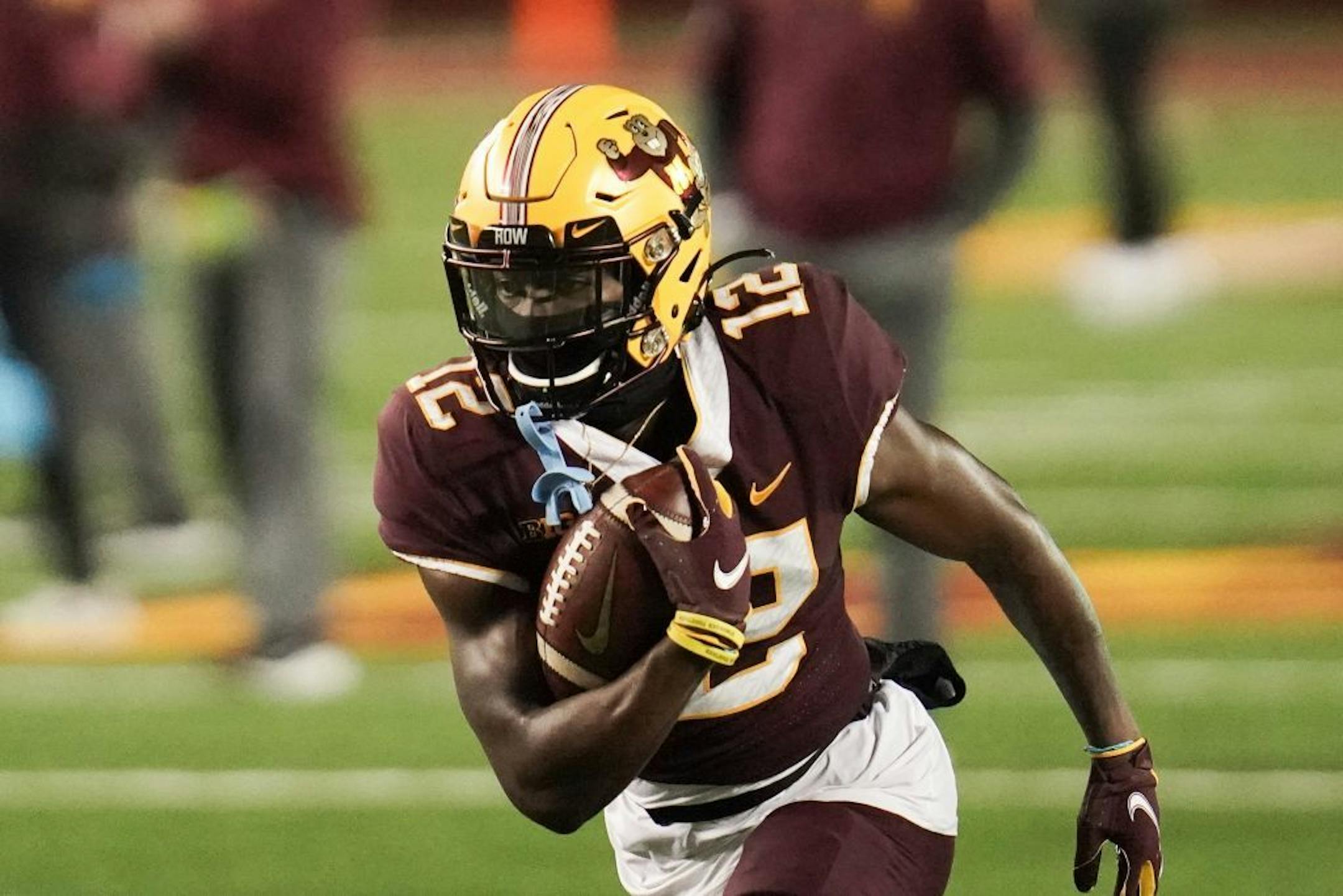 Minnesota Gophers running back Bryce Williams (21) warmed up before the game.