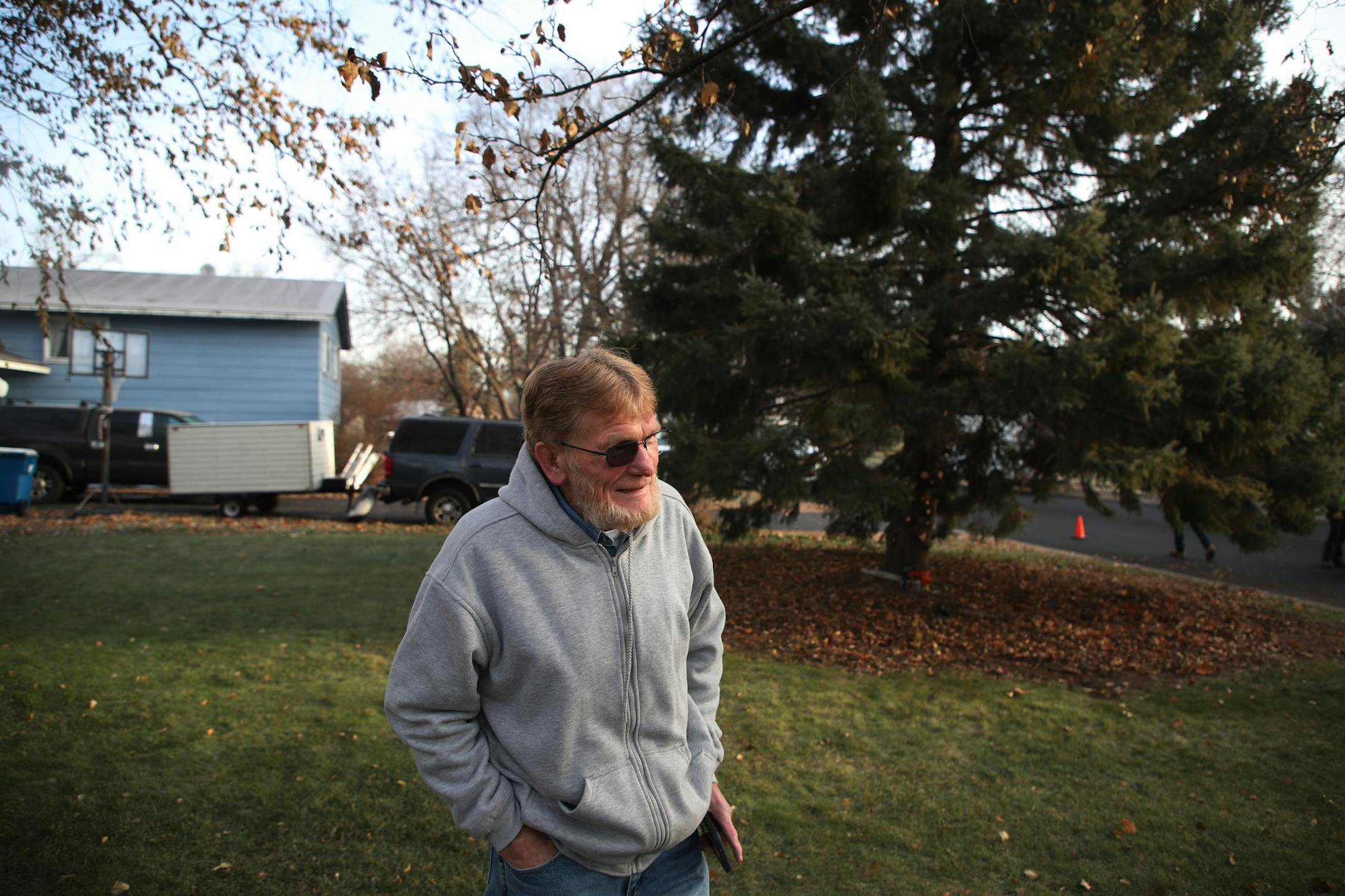 Bob Brass watched as Anoka city crews removed a 44-foot Black Hills spruce tree from his yard Monday November 20, 2017 in Anoka, MN. The tree will serve as this years Christmas tree and will be placed in front of City Hall.] JERRY HOLT &#xef; jerry.holt@startribune.com