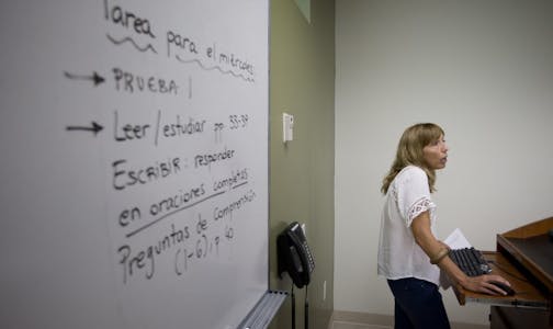 In this Sept. 9, 2013 photo, University of Miami professor Francisca Aquilo-Mora works with students in her Spanish language class in Coral Gables, Fla. Learning a foreign language in college is a requisite for many students, but what if you grew up speaking that language, you just can�t read it or write it? That�s the case for many second-generation immigrant children. Over the last two decades, a growing number of schools have introduced foreign language classes for �heritage learners,� studen